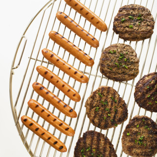 Hot dogs and hamburgers on grill.