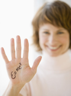 Woman with formula written on hand.