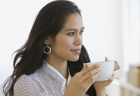 Woman drinking coffee.