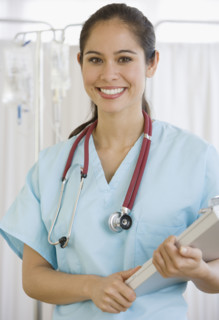 Female doctor holding chart.