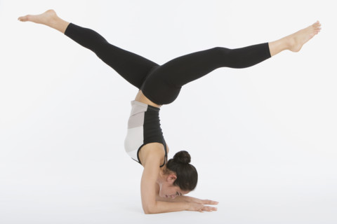 Woman practicing yoga.