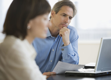 Businessman looking at laptop.