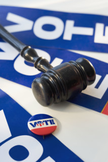 Judge’s gavel on vote signs.