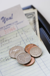Restaurant bill with money.