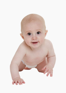 Studio shot of baby crawling.