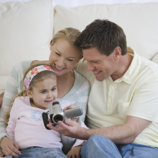 Family looking at video camera.