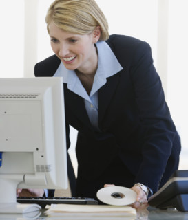 Businesswoman looking at computer.