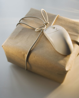 Close up of package and computer mouse.