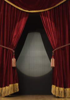 Spotlight on open stage curtains.