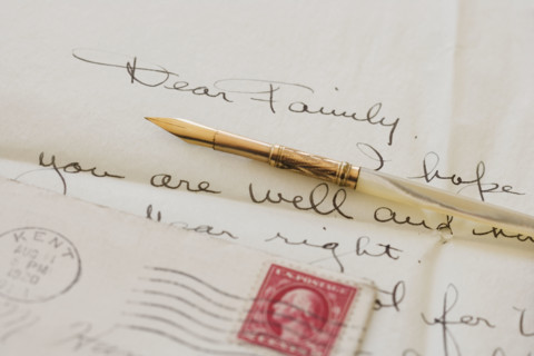 Quill pen on old letter.