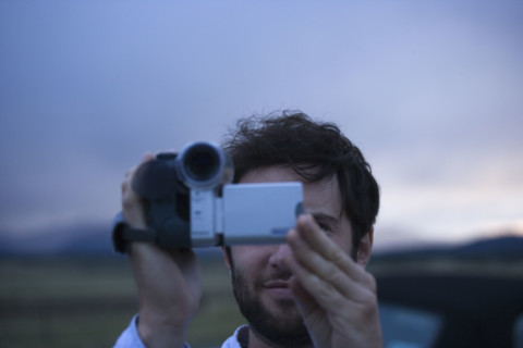 Man using video camera. Date : 2006