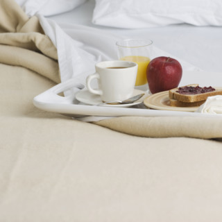 Still life of breakfast tray on bed. Date : 2006