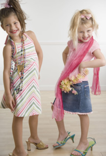 Two young sisters playing dress-up . Date : 2006