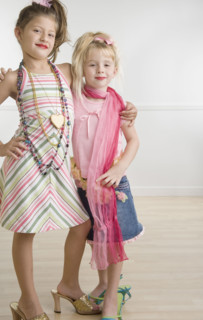 Two young sisters playing dress-up . Date : 2006
