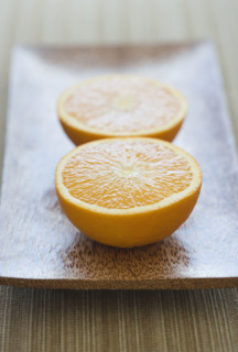 Close up of orange halves on plate. Date : 2006