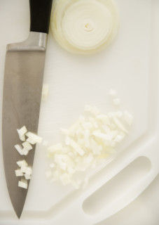 Chopped onions on cutting board. Date : 2006