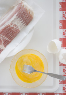 High angle view of raw bacon and eggs. Date : 2006