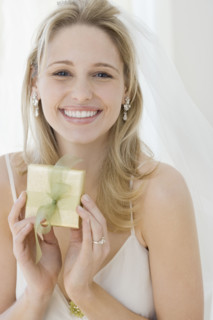 Portrait of bride holding gift. Date : 2007