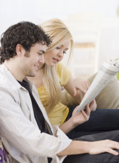 Couple reading newspaper. Date : 2007