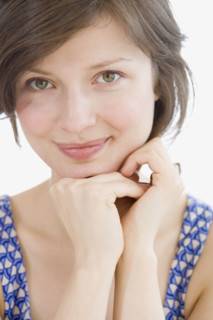 Woman leaning chin on hands. Date : 2007