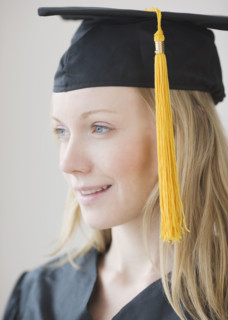 Woman wearing graduation cap and gown. Date : 2007