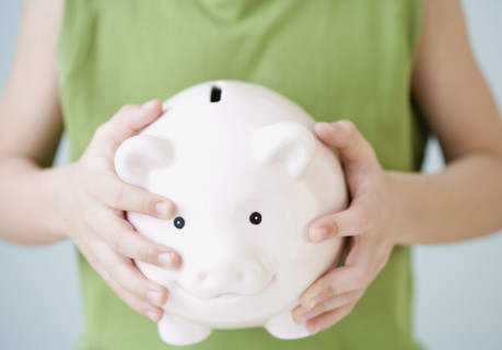 Boy holding piggy bank. Date : 2007