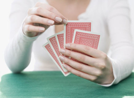 Woman playing cards. Date : 2007