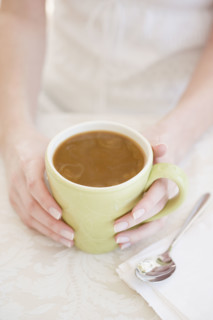 Woman drinking iced coffee. Date : 2007