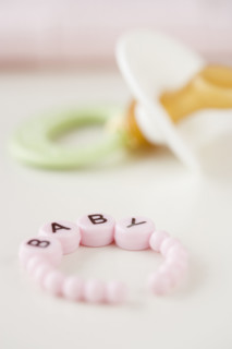 Baby bracelet and pacifier. Date : 2007