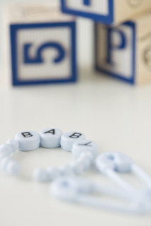 Baby bracelet and blocks. Date : 2007