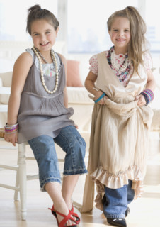 Portrait of sisters playing dress up. Date : 2006