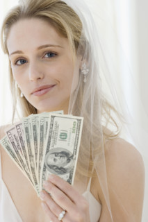 Portrait of bride holding money. Date : 2007