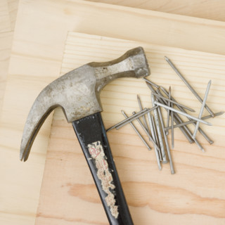 Close up of hammer and nails. Date : 2006