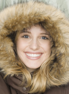 Portrait of woman wearing fur lined hood. Date : 2007