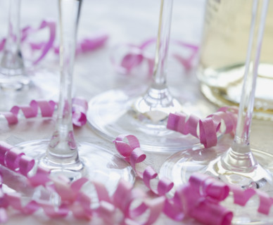 Close up of wine glasses and curled ribbon. Date : 2006