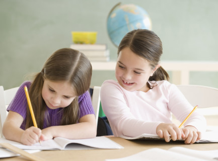 Two girls studying in classroom. Date : 2006