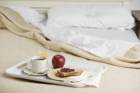 Still life of breakfast tray on bed. Date : 2006