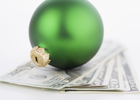 Studio shot of money and Christmas tree ornament. Date : 2006