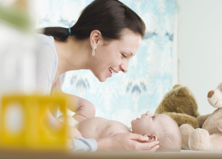 Mother smiling at baby. Date : 2006