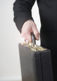 Businessman carrying a briefcase. Date : 2006