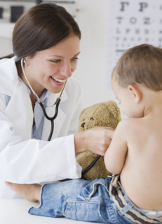 Doctor examining baby. Date : 2007