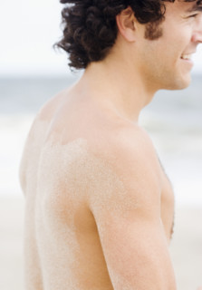 Man with sand on back. Date : 2007