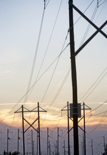 Electrical poles and wires at sunset. Date : 2007
