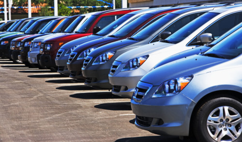 Row of new cars on lot. Date : 2007