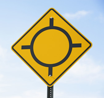 Low angle view of traffic circle sign. Date : 2007