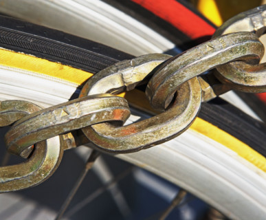 Close up of chain over bicycle tire. Date : 2007