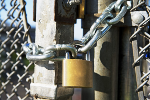 Close up of padlock on gate. Date : 2007