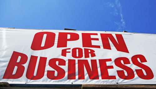 Low angle view of Open for Business sign. Date : 2007