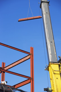Crane holding steel girder. Date : 2007