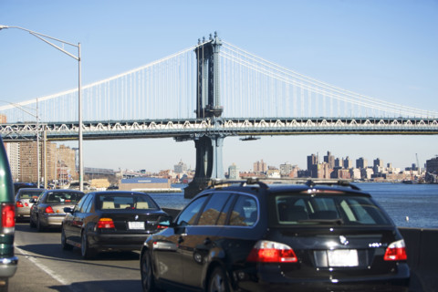 Traffic with bridge in background. Date : 2007